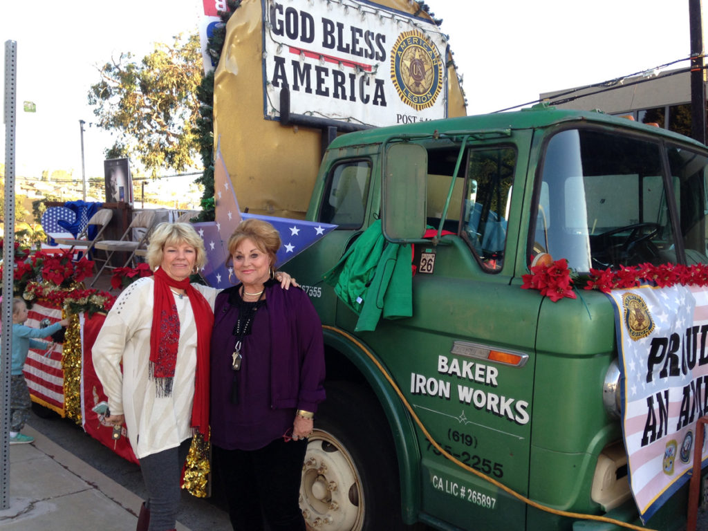 Cynthia and Susan stand in front of the Baker Iron Works truck.