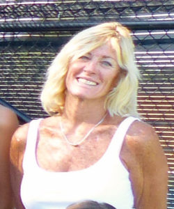 Coach Deb in front of courts