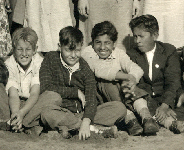 A young Shorty, sitting with friends