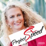 Denise holding "Project Speed" sign